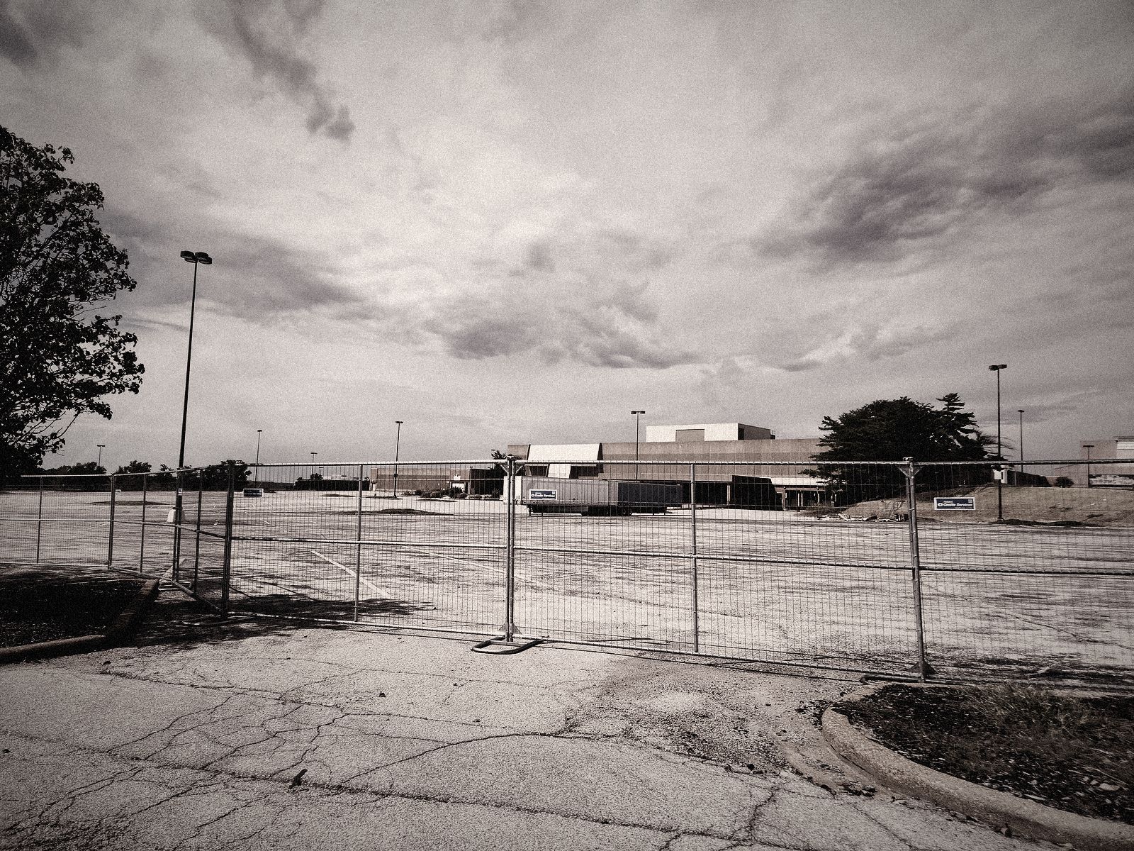 Fenced off empty parking lot
